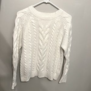 White cable knit long sleeve sweater